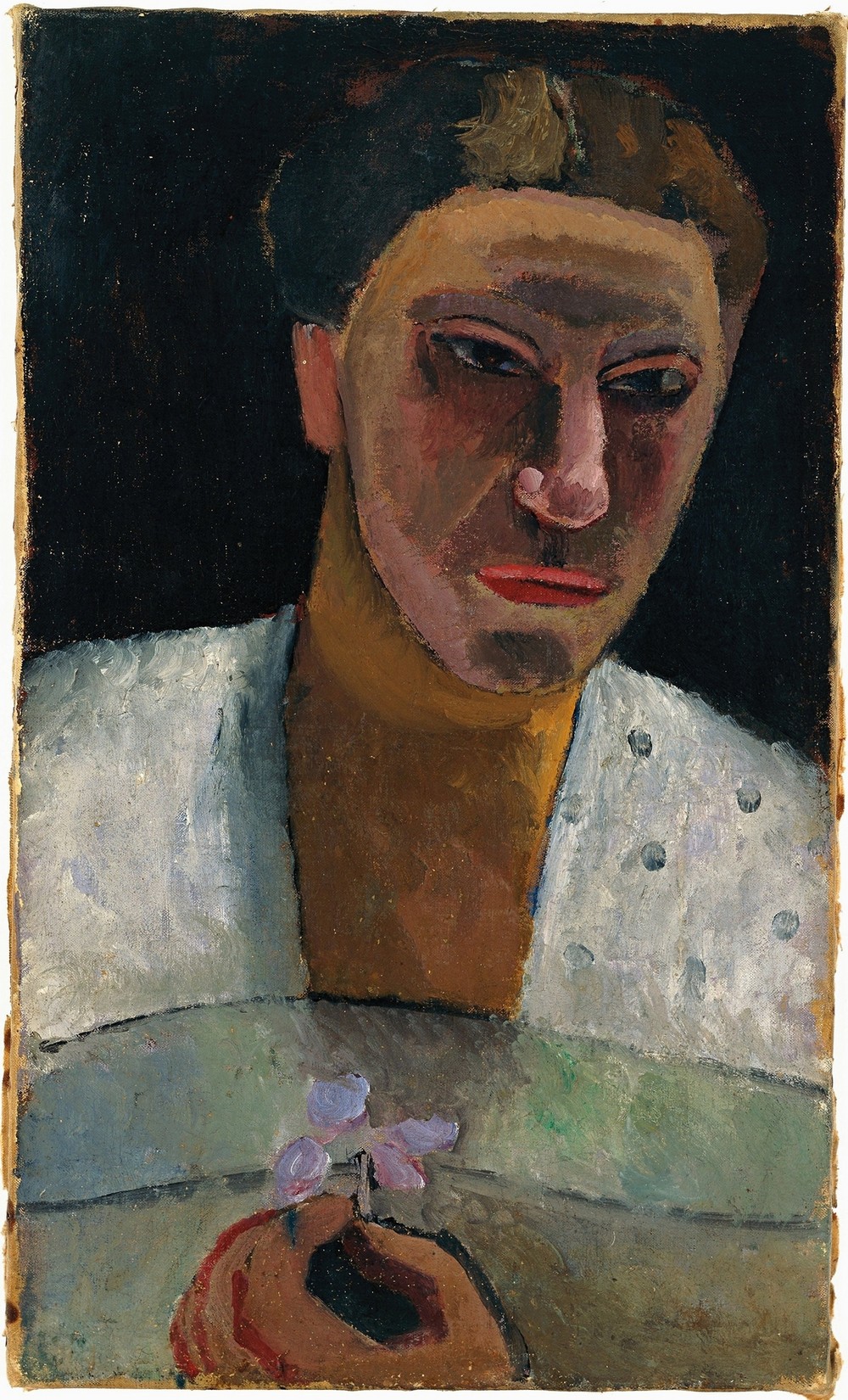 Half-length portrait of Lee Hoetger with flower