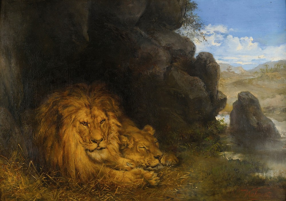 Two lions in a cave