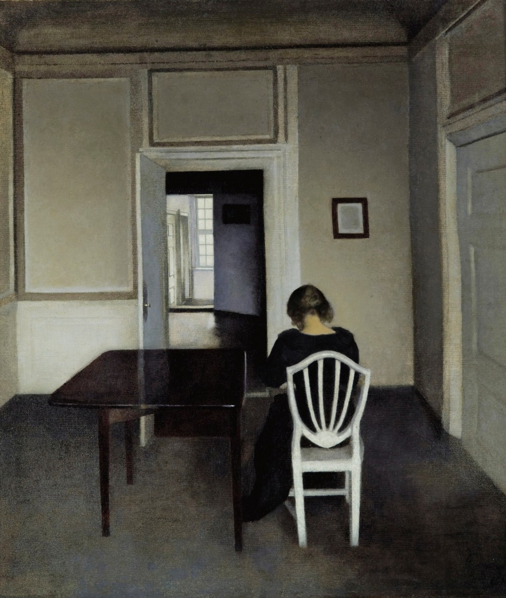 Interior With Ida in A White Chair