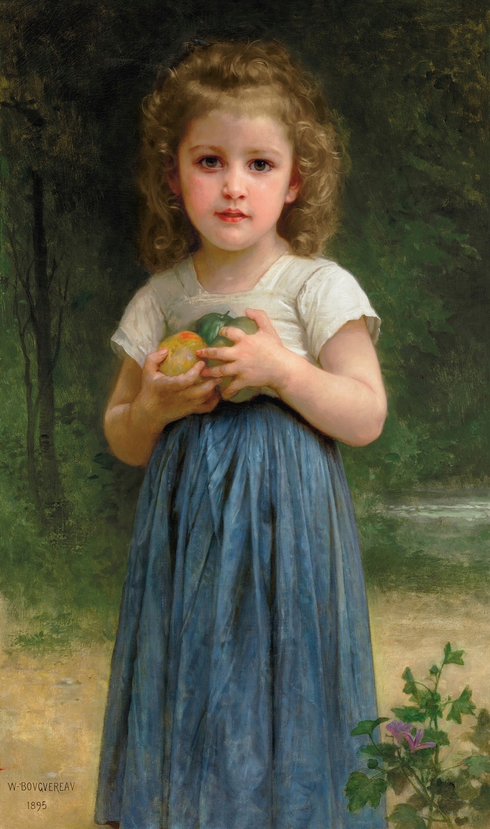 Petite fille tenant des pommes dans les mains