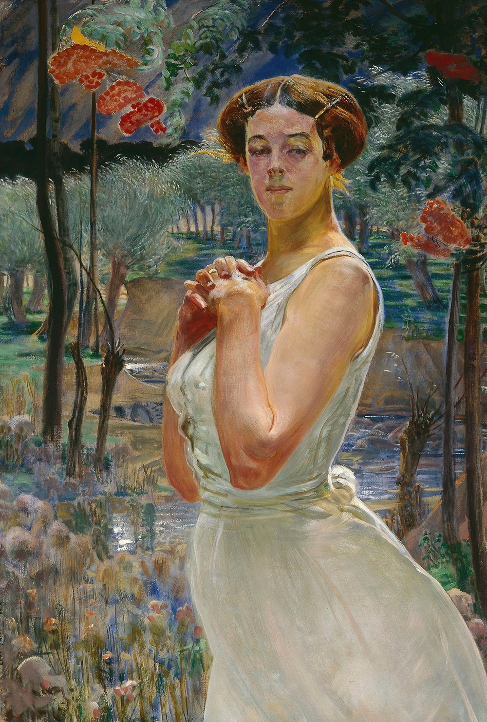 Portrait of a woman against a rowanberry grove