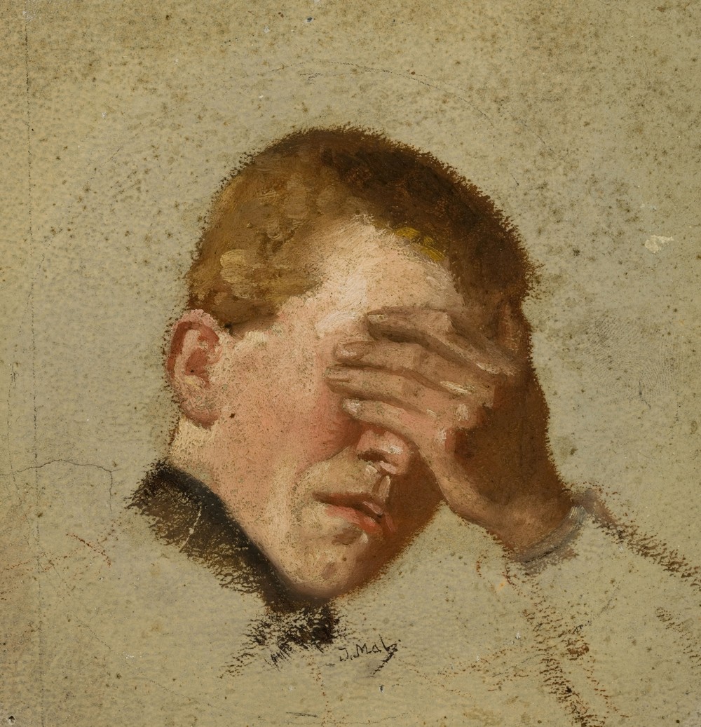 Boy covering his eyes