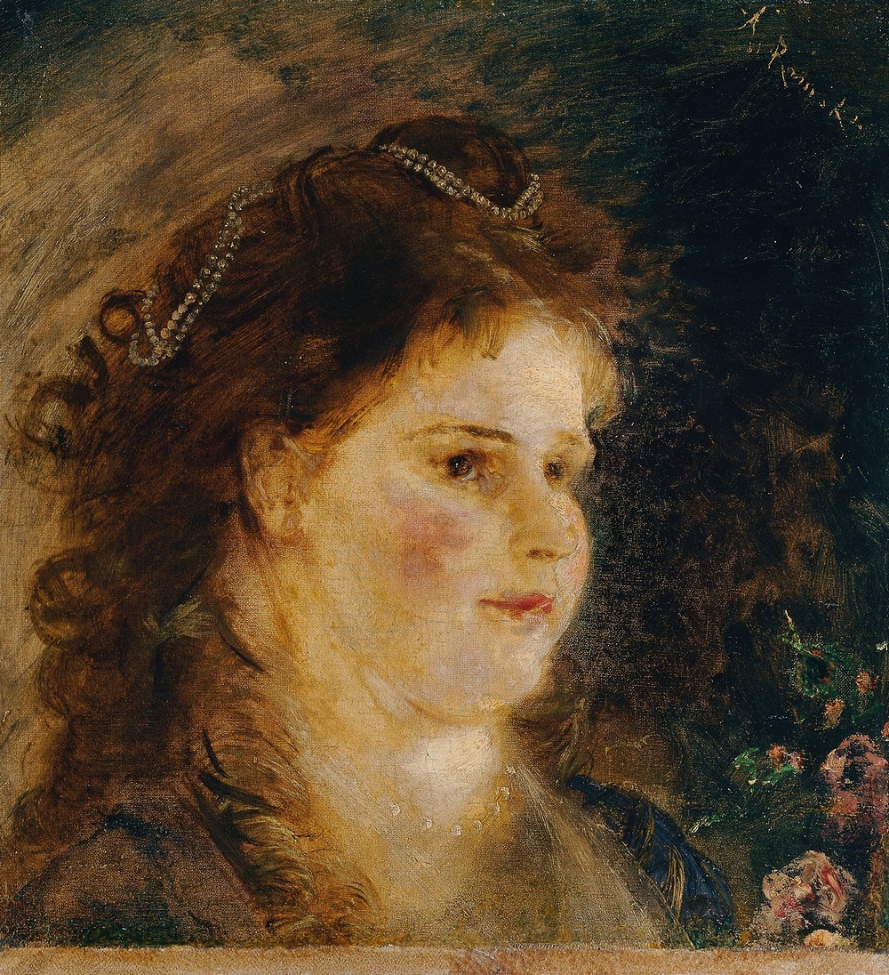Mädchen mit Perlenkette im Haar